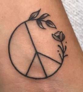 Discover the Symbolism Behind Peace Sign Tattoos