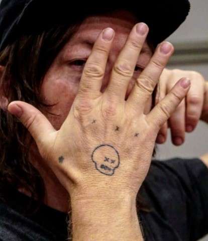 Norman Reedus Hand Tattoo Meaning