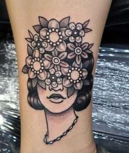 Woman With Flower Head Tattoo Meaning