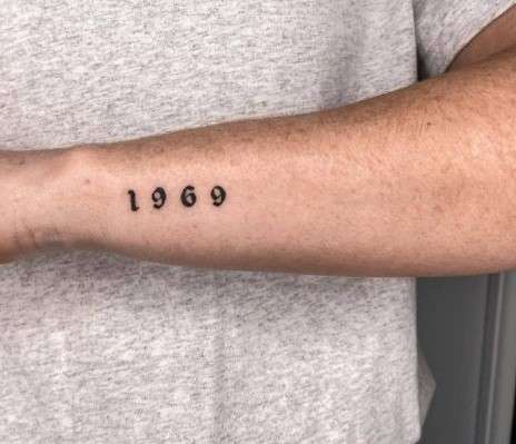 1969 Tattoo on left arm