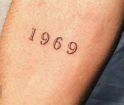 1969 Tattoo on right arm