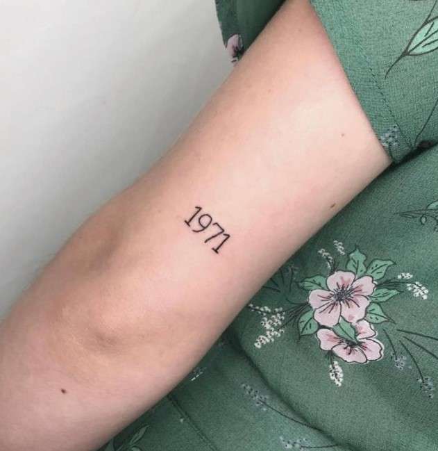 1971 tattoo on left arm