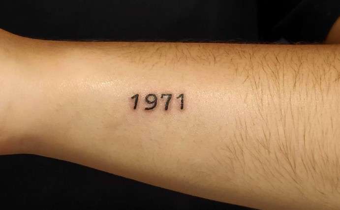 1971 tattoo on left hand