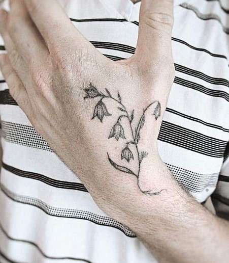 Lily of the Valley Tattoo on finger