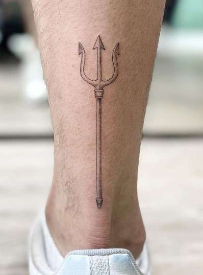 trident on foot tattoo