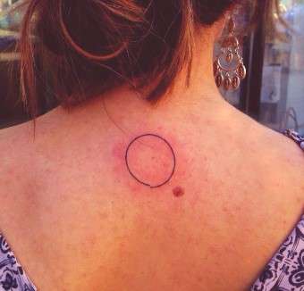Red Circle Tattoo on back
