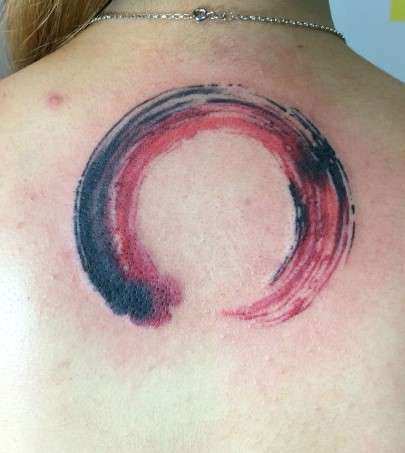 Red Circle Tattoo with black shades
