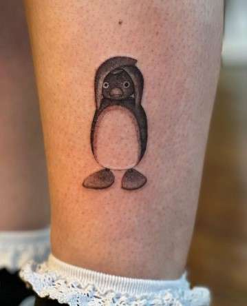 playful penguin tattoo design
