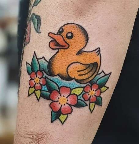 Rubber Duck Tattoo with flower