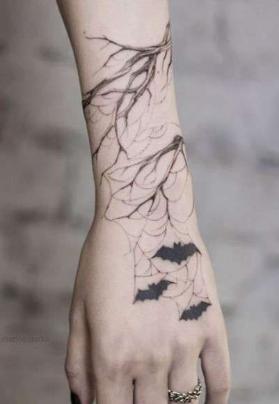 Feminine Bat tattoo on arm