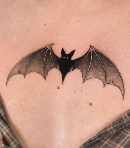 Feminine Bat tattoo on chest