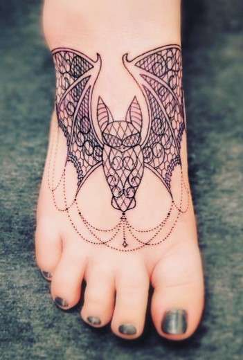 Feminine Bat tattoo on feet