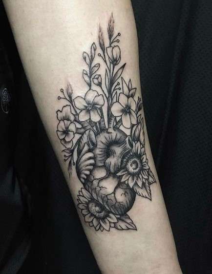 Dark Anatomical Heart Tattoo With Flowers 