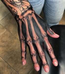 Bone hand tattoo