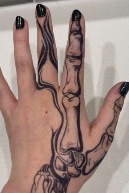 Female Bone hand tattoo