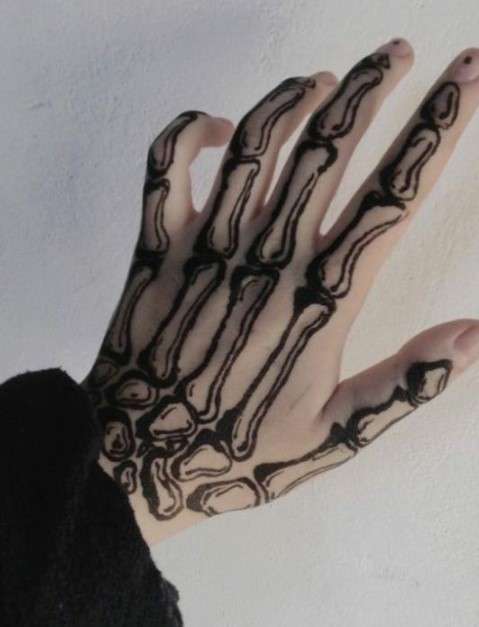 simple Bone hand tattoo