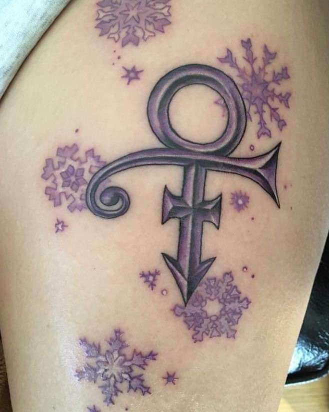 Feminine Prince symbol tattoo on thigh