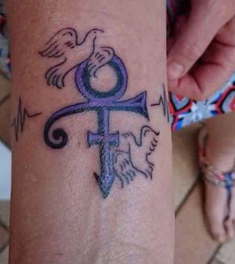 Feminine Prince symbol tattoo on hand