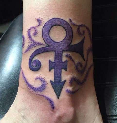 Prince symbol tattoo on leg
