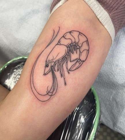 Shrimp tattoo on arm