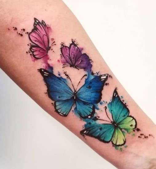 Colorful whimsical butterfly tattoo
