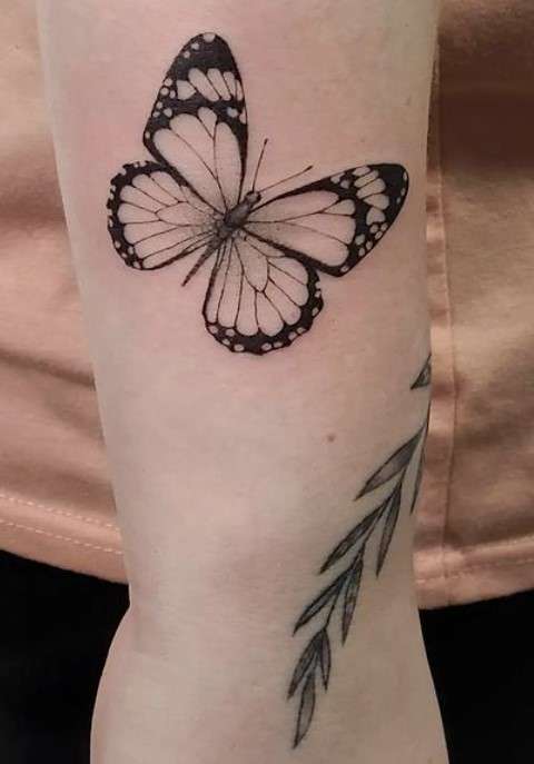 Whimsical butterfly tattoo black white