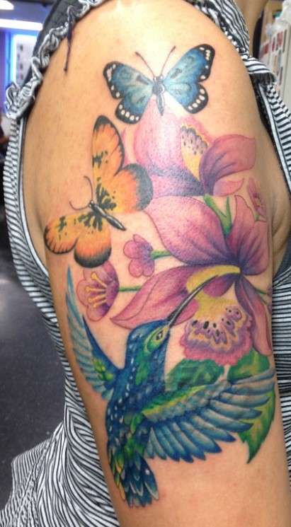 Whimsical butterfly hummingbird tattoo sleeve