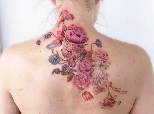 Whimsical Flower tattoo back neck