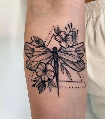 Whimsical dragonfly tattoo abstract