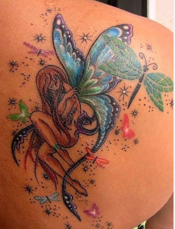 Whimsical dragonfly tattoo back shoulder