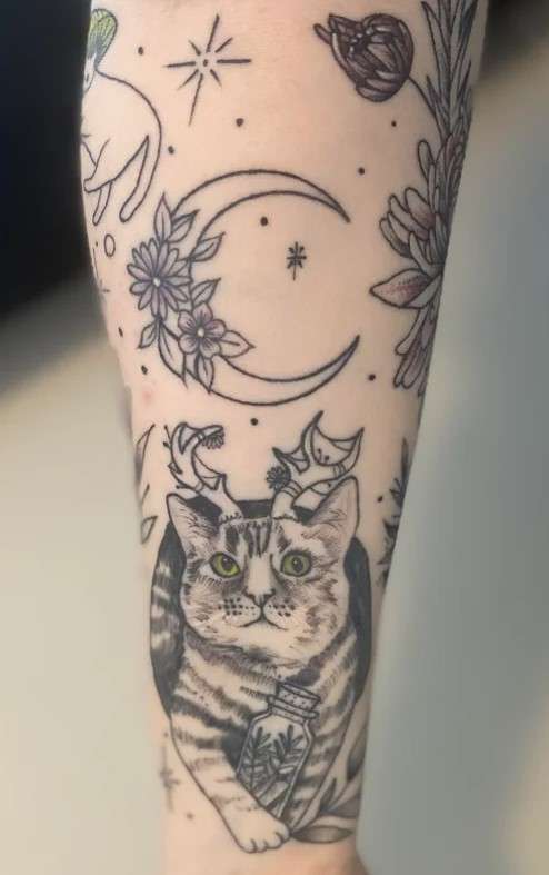 Whimsical tattoo sleeve cat and moon flower
