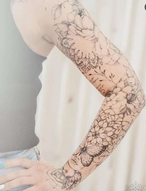 Whimsical tattoo sleeve butterfly and mandala flower