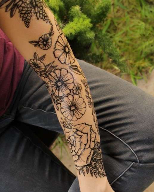 Whimsical tattoo sleeve dark flower