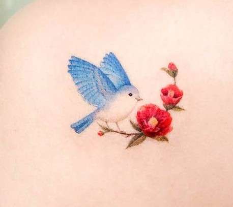 Whimsical bird tattoo blue and red