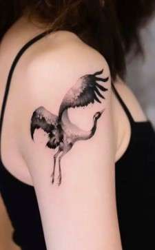 Whimsical bird tattoo big bird