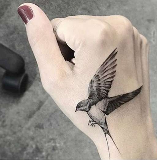 Whimsical bird tattoo free spirit
