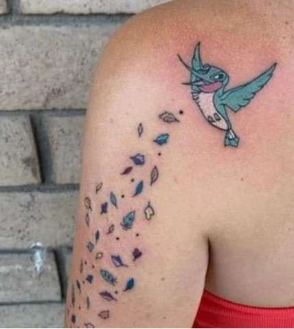 happy Whimsical bird tattoo
