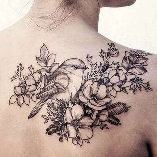Whimsical bird tattoo with flower