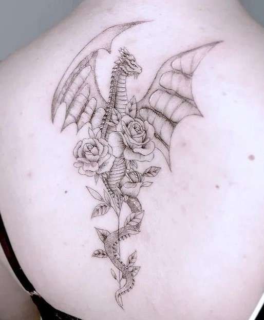 Whimsical Dragon holding flower tattoo