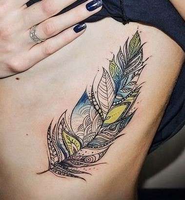 yellow Whimsical feather tattoo
