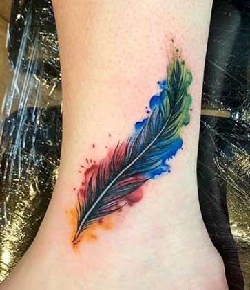 colorful Whimsical feather tattoo