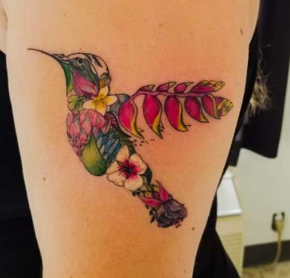 Whimsical Hummingbird tattoo art by flowers