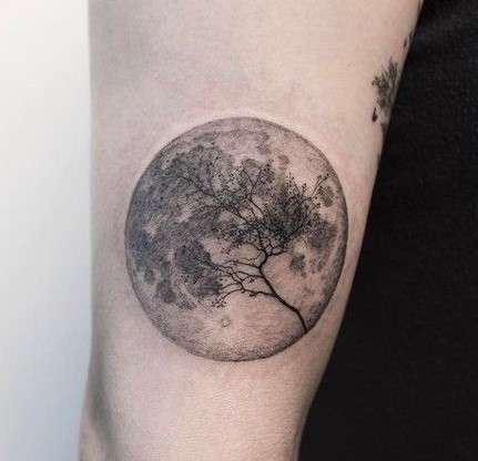 Whimsical full Moon tattoo