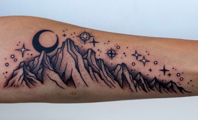 Whimsical mountain Moon tattoo