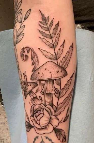 Whimsical Mushroom tattoo with fern
