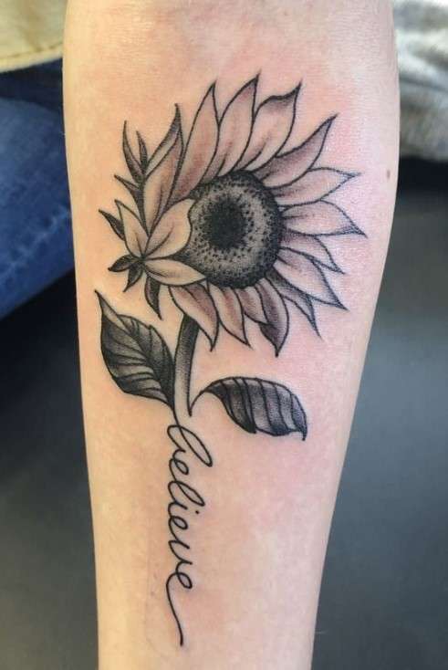 Whimsical sunflower tattoo on hand