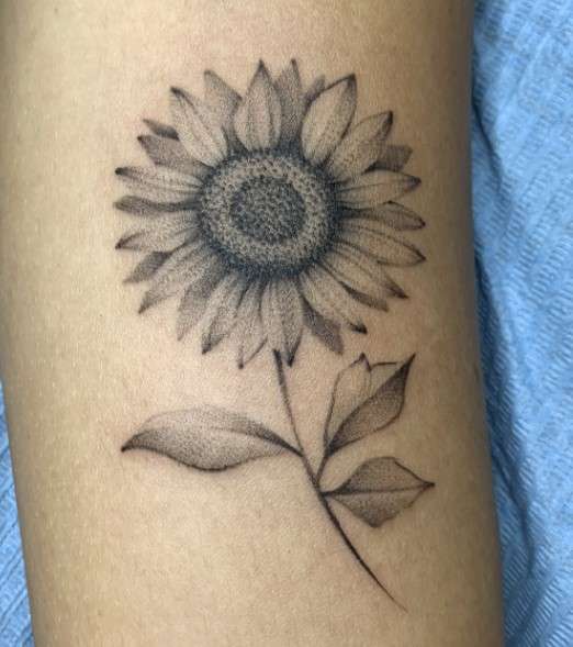 Whimsical  simple sunflower tattoo