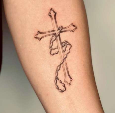 Whimsical Cross rosary tattoo