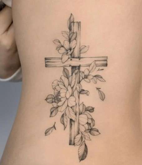 Whimsical leaf Cross tattoo