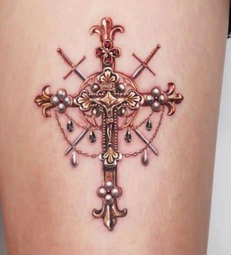 Whimsical monarch Cross tattoo